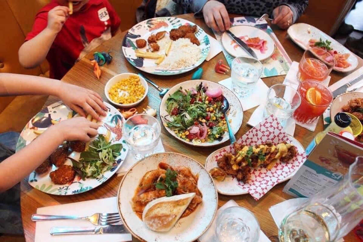 A table full of plates of Latin American food at Las Iguanas